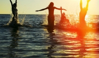 Playing in sunset sea